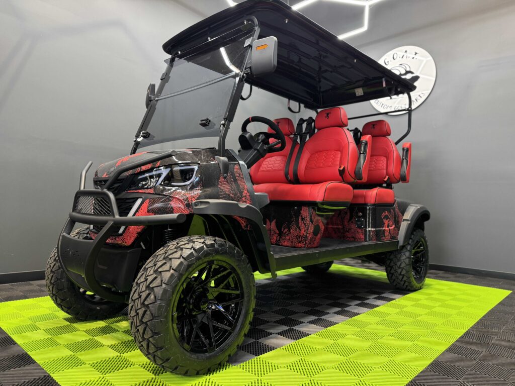 Fireball Whisky custom golf cart by GOAT Custom Golf Carts, lifted 6-seater with black and red dragon wrap
