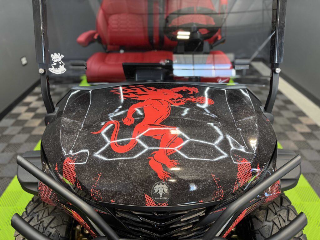 Fireball dragon graphic on the hood of a custom MammothEV golf cart by GOAT Custom Golf Carts