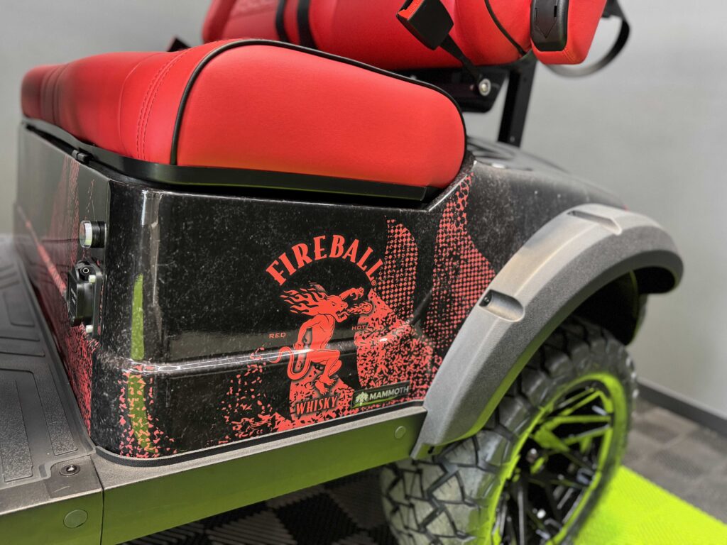 Fireball Whisky logo detail on the rear body wrap of a custom golf cart by GOAT Custom Golf Carts