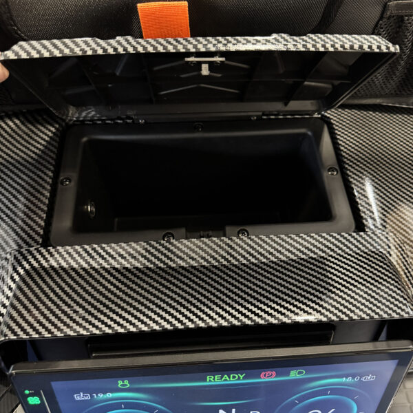 Upper dash cubby hidden storage in a MammothEV golf cart