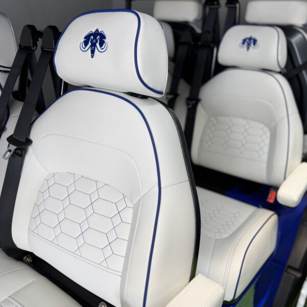 Premium custom leather seats with stitching in a golf cart