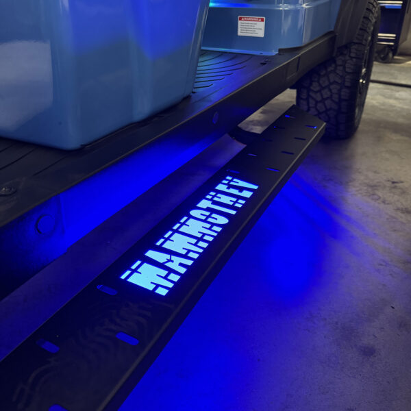 Frame-mounted LED side steps on a MammothEV custom golf cart
