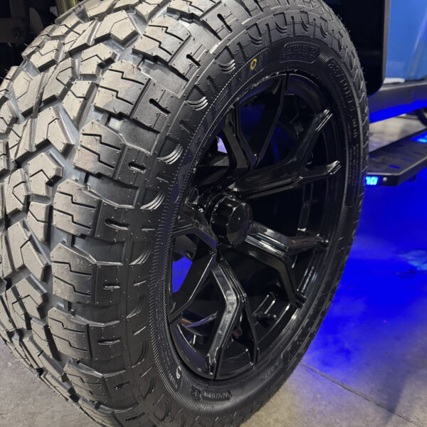 14-inch premium gloss black wheels on a MammothEV golf cart