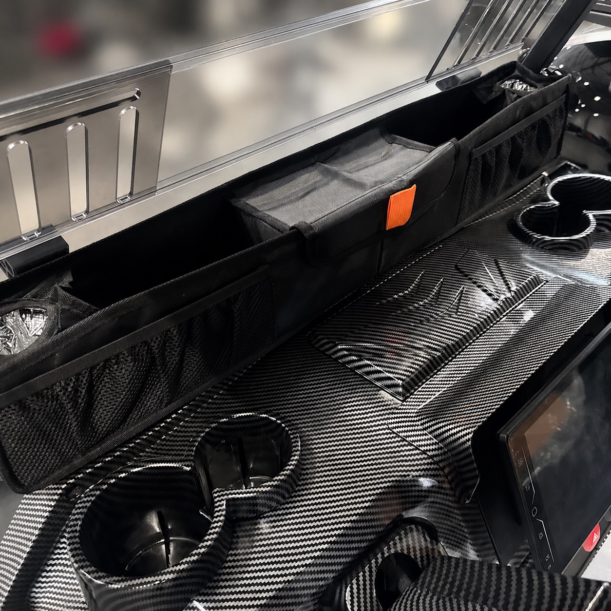 Front dash storage compartment in a custom golf cart