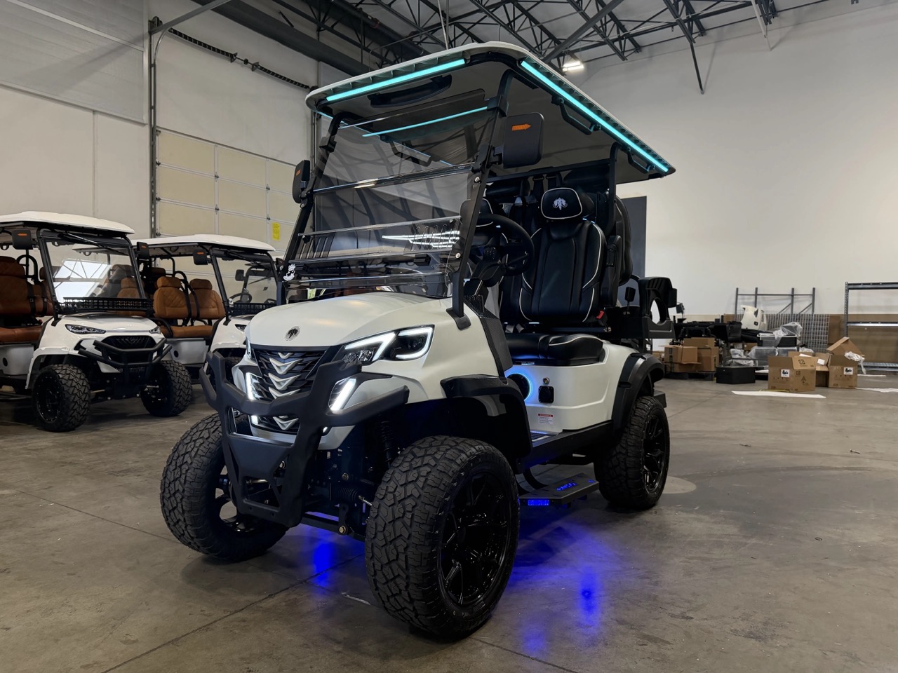 Pearl white MammothEV XR2 custom golf cart with icy blue LEDs delivered to Saginaw, MI